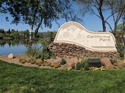 California Park sign with the lake and trees in the background